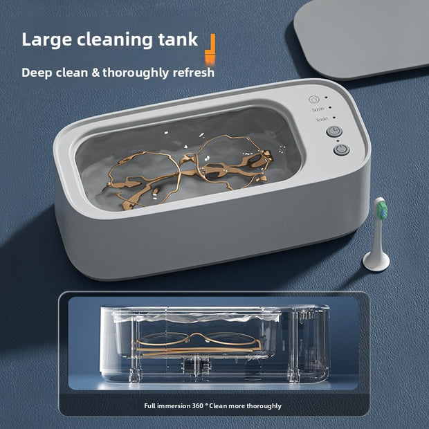 Ultrasonic cleaner with a toothbrush and glasses inside on a blue background