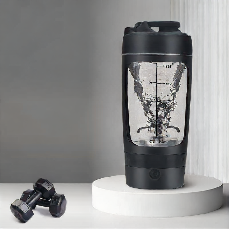 Black protein shaker with measurement markings on a white surface with dumbbells.