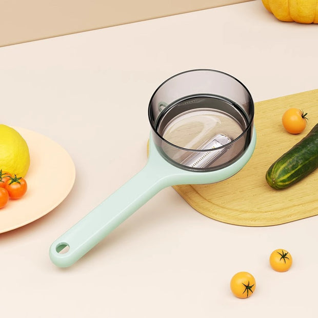 Kitchen strainer with a light blue handle on a table with vegetables
