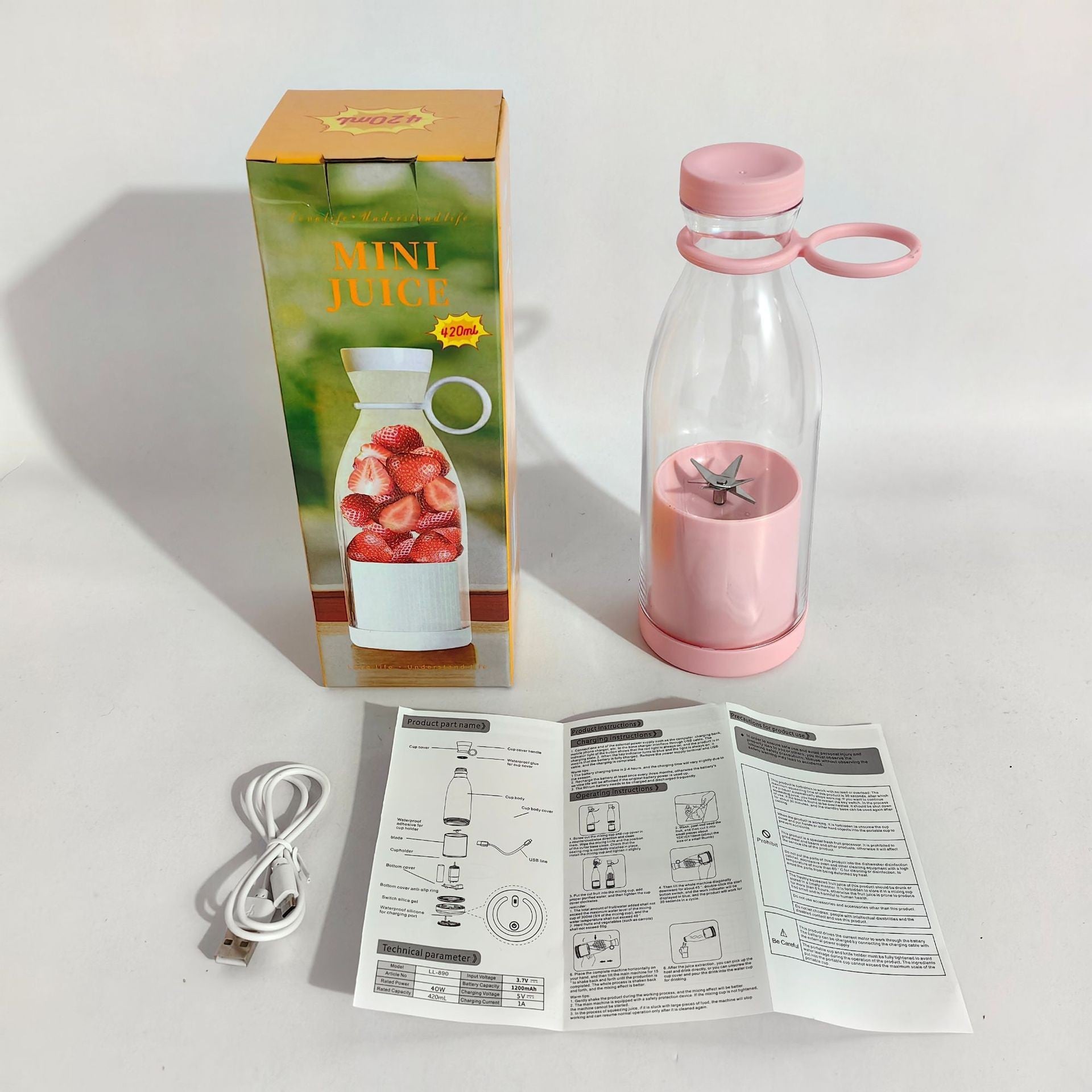 Pink and clear bottle with pink cap, packaging, and user manual on a white surface