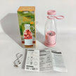 Pink and clear bottle with pink cap, packaging, and user manual on a white surface