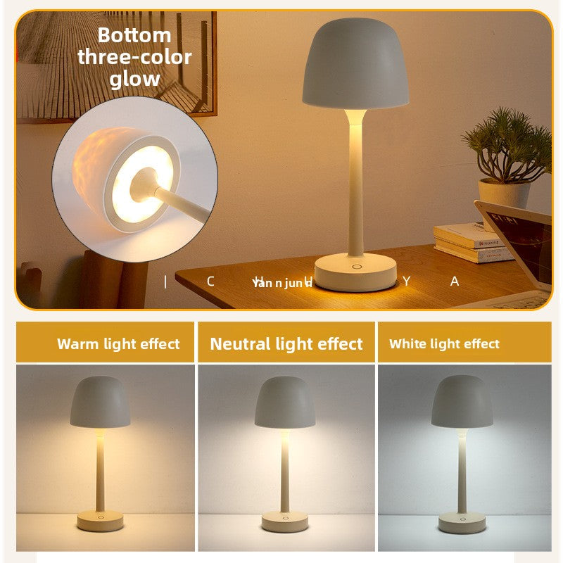 Table lamp with different light effects on a wooden surface.