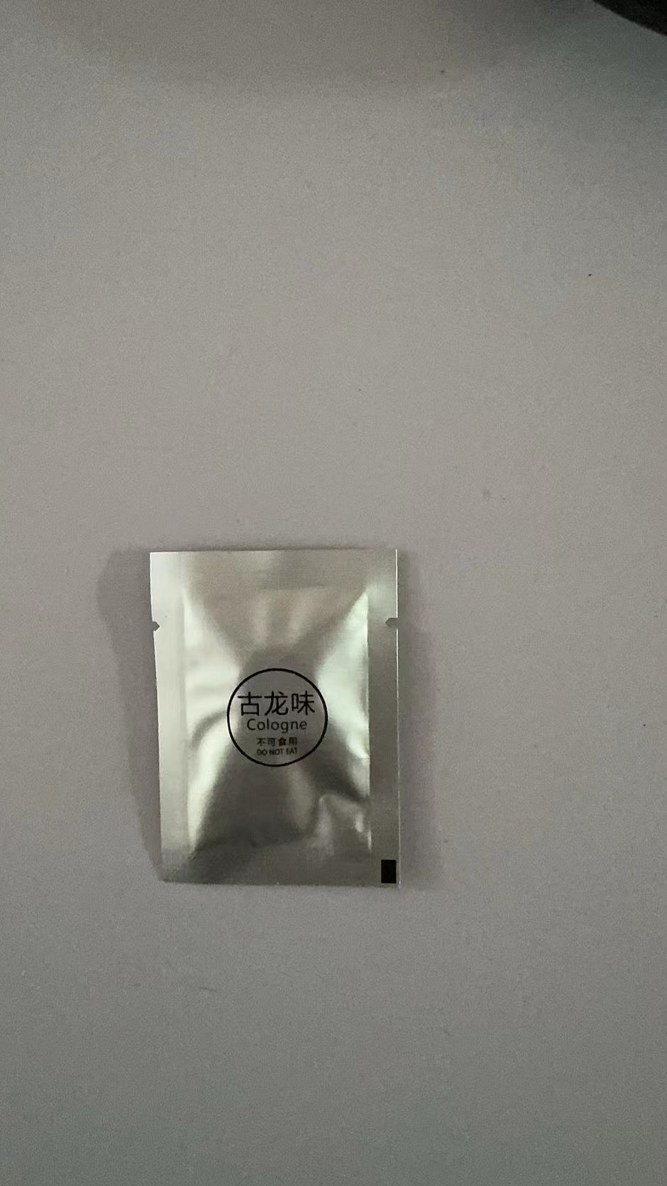 Small silver packaging on a light gray background
