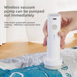 Hand using a white wireless vacuum pump on a plastic bag with text about its features.
