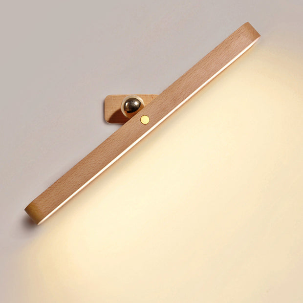 Wooden wall lamp with warm light on a neutral background