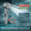 Stainless steel handheld shower head with pressure boosting filtration on a dark background