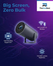 A modern wireless camera next to a large screen, showcasing its lightweight design and high-tech features.