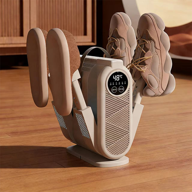 Shoe dryer with shoes on a wooden floor