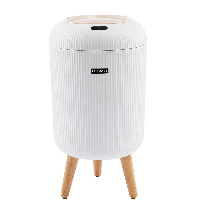 White cylindrical stool with wooden legs on a white background