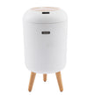 White cylindrical stool with wooden legs on a white background