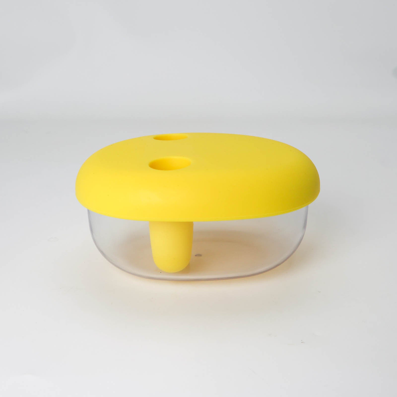 Yellow plastic tool with a clear cylindrical body on a white background