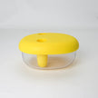 Yellow plastic tool with a clear cylindrical body on a white background