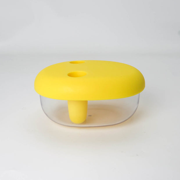 Yellow plastic tool with a clear cylindrical body on a white background