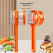 Orange vegetable peeler with a clear handle on a table with vegetables and a beige curtain background.