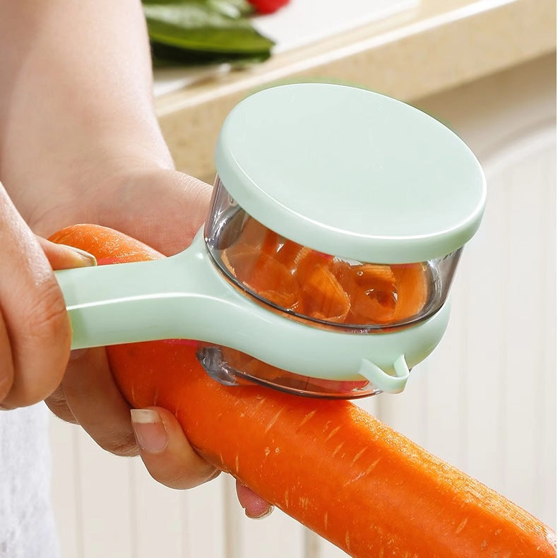Person using a carrot peeler to remove the skin of a carrot.