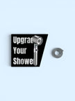 Shower head with a spring on a light blue background, featuring text 'Upgrade Your Shower'.