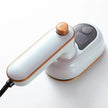White handheld device with gold accents on a white background