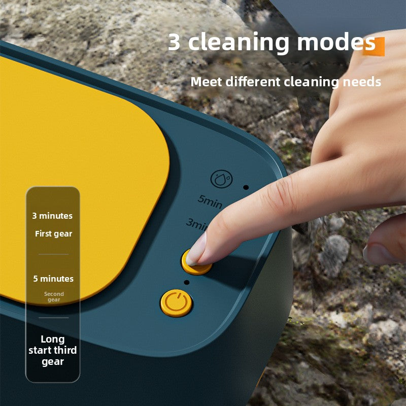 Cleaning device with button being pressed, showing cleaning modes on a rocky background