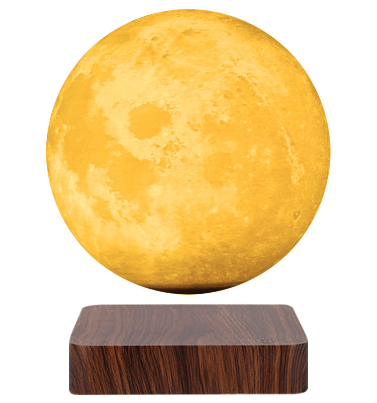 Moon-shaped lamp with wooden base on a white background