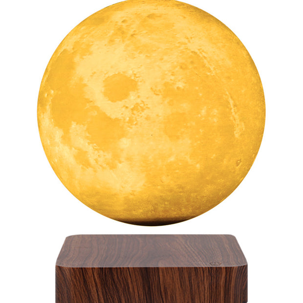 Moon-shaped lamp with wooden base on a white background