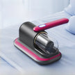 Black and pink handheld device on a light blue background