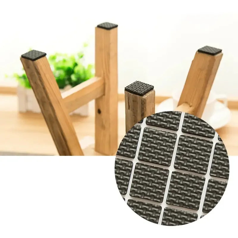 Wooden furniture legs with black rubber pads on a white background