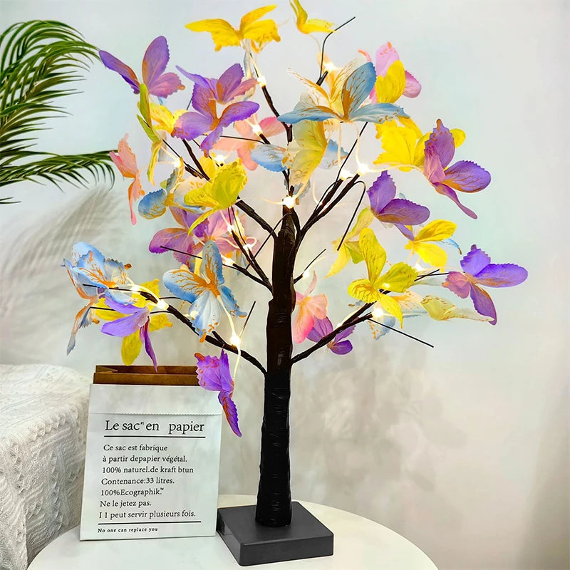 Decorative lamp with colorful butterfly-shaped lights on a white surface.