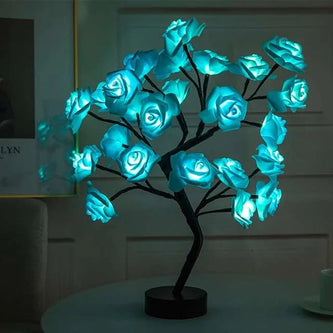 Decorative LED tree with blue glowing flowers on a dark background