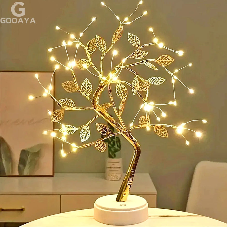 Decorative LED tree lamp on a table with a GOOAYA logo in the corner.