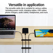 Laptop and tablet with cables managed by a cable clip on a wooden surface.