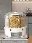 White kitchen storage container with compartments filled with grains on a countertop.