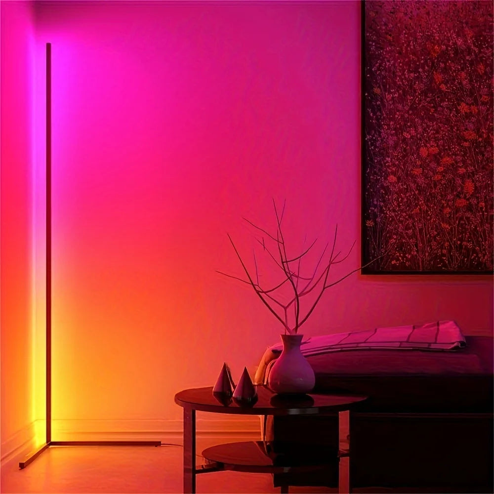 Modern interior with a gradient wall light, table with decorative items, and abstract painting.