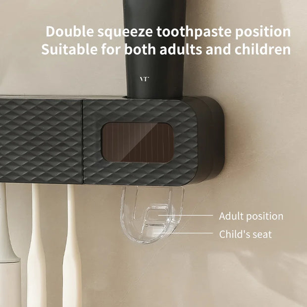 Black toothpaste dispenser with text indicating double squeeze position for adults and children, on a neutral background.