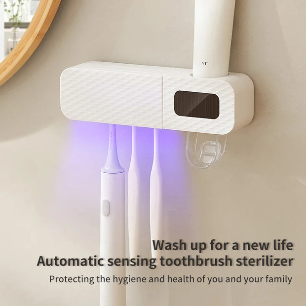 Automatic sensing toothbrush sterilizer with two toothbrushes inside, mounted on a wall.