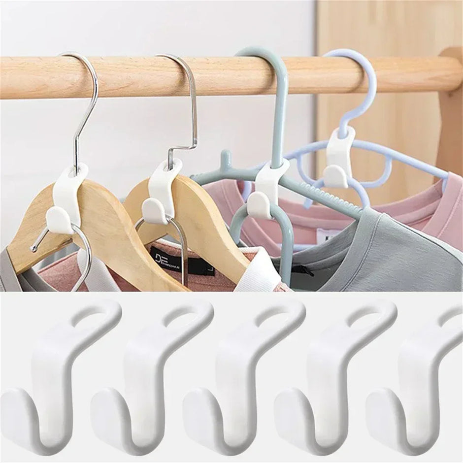 Set of multi-layered hangers on a wooden rod with clothes, followed by multiple white hangers stacked.