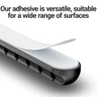 Adhesive strip on a surface with text about its versatility.