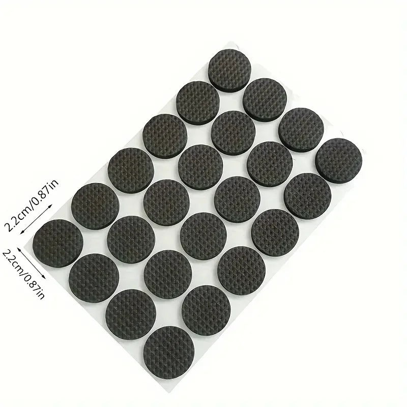Set of black round furniture pads with measurements on a white background