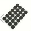 Set of black round furniture pads with measurements on a white background