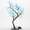 Decorative lamp with blue flower-like lights on a white background