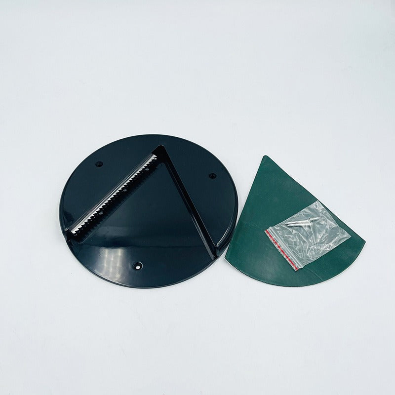 Black circular metal component and green plastic part on a white background