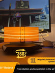 Magnetic levitation speaker with 360° rotation, floating orange cube design for modern home audio