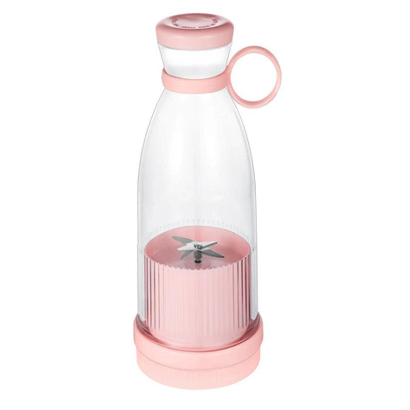 Pink and clear portable blender on a white background