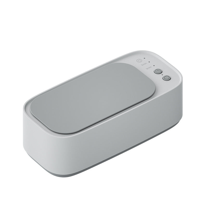 Rectangular electronic device with a gray surface on a white background