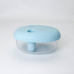 Clear container with a light blue lid on a white background