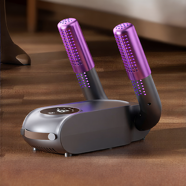 Hair straightening device with purple handles on a wooden floor