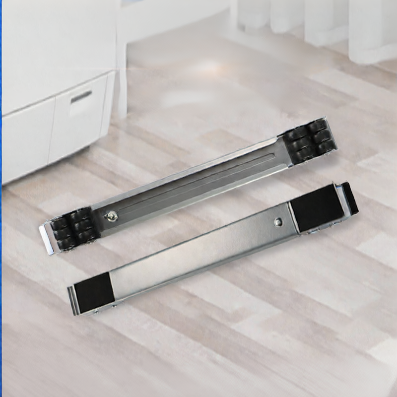 Two metal drawer slides on a wooden floor with white cabinets in the background.