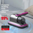A pink and purple vacuum cleaner rests on a neatly made bed, showcasing its vibrant colors and modern design.