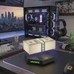 Levitating money stack on LED base, modern desk setup with RGB PC and gaming gear